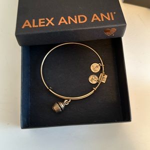 Alex and Ani gold cupcake bracelet.